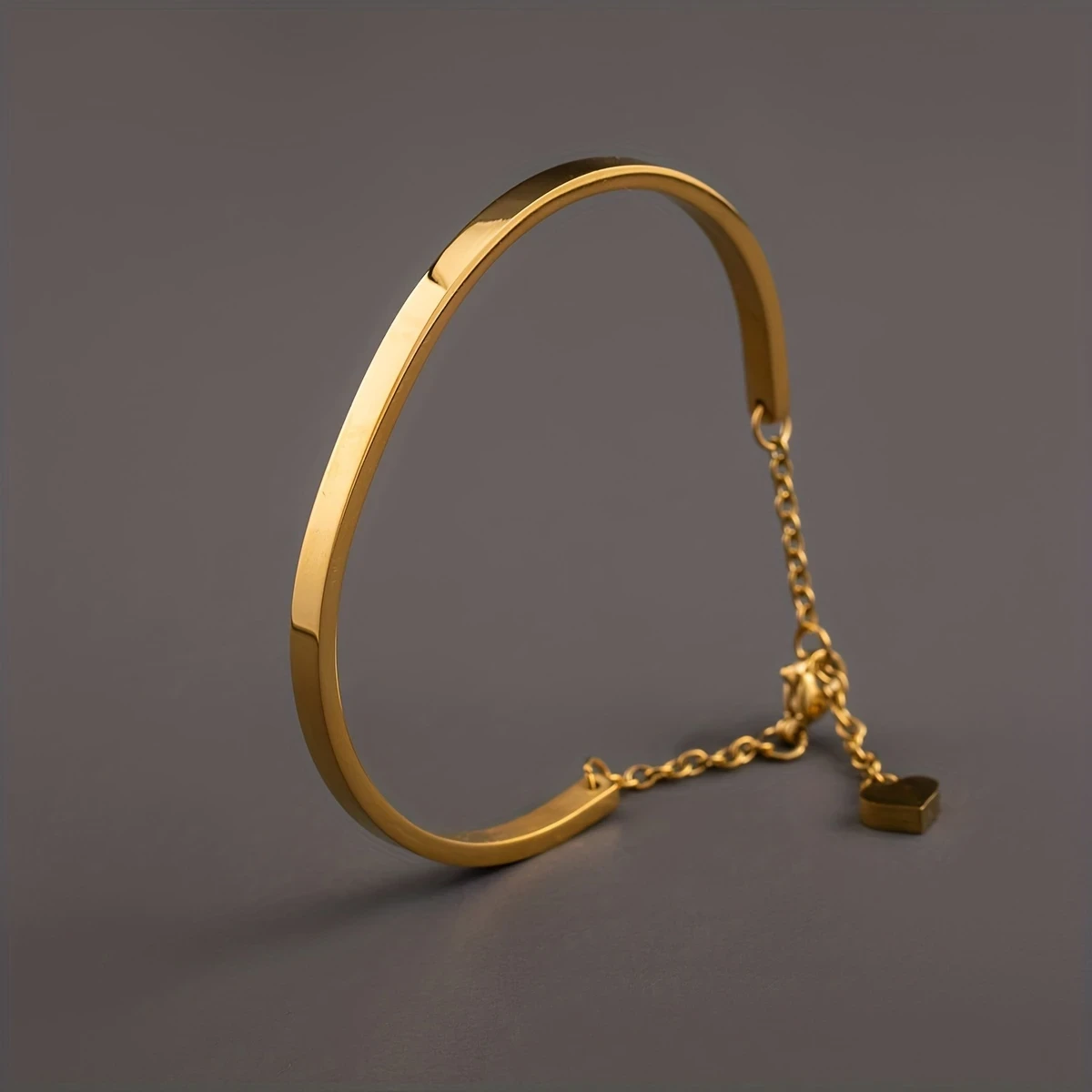 Golden-Plated Stainless Steel Heart Pendant Bracelet with Chain Extension – Unisex Fashion Accessory for Men and Women, Perfect for Couples or Casual Attire