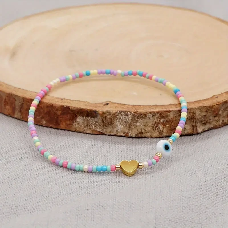 Bohemian Handwoven Glass Bead Bracelet with Heart Charm and Evil Eye Accent, Adjustable Multicolor Strand for Daily Wear and Gift-Giving, No Plating – 1PC