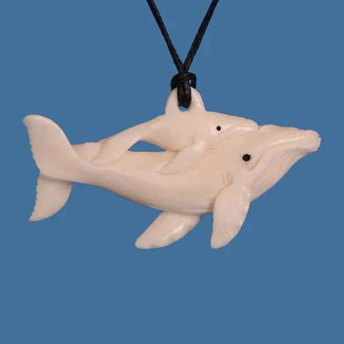 Whale with baby bone carving