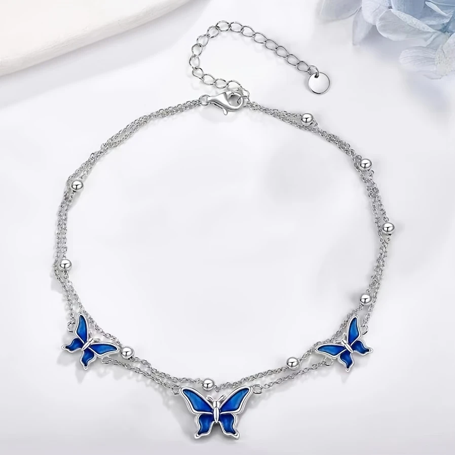 White Golden Butterfly Anklet – Elegant White Golden-Plated Copper Butterfly Anklet with Blue Enamel Accents