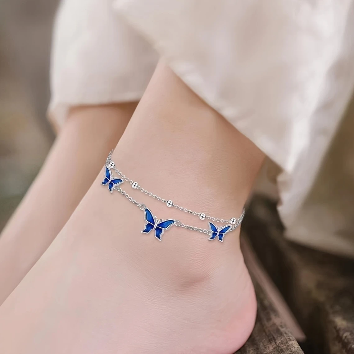 White Golden Butterfly Anklet – Elegant White Golden-Plated Copper Butterfly Anklet with Blue Enamel Accents
