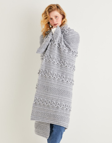 Manta de merino con detalle de pompones | Hecha a mano | Hecha a mano