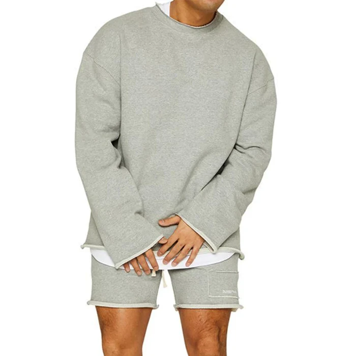 Conjunto de sudadera y pantalones cortos sueltos de color liso a la moda para hombre