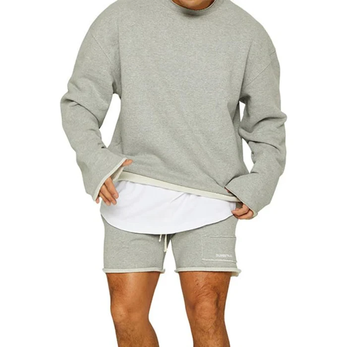 Conjunto de sudadera y pantalones cortos sueltos de color liso a la moda para hombre