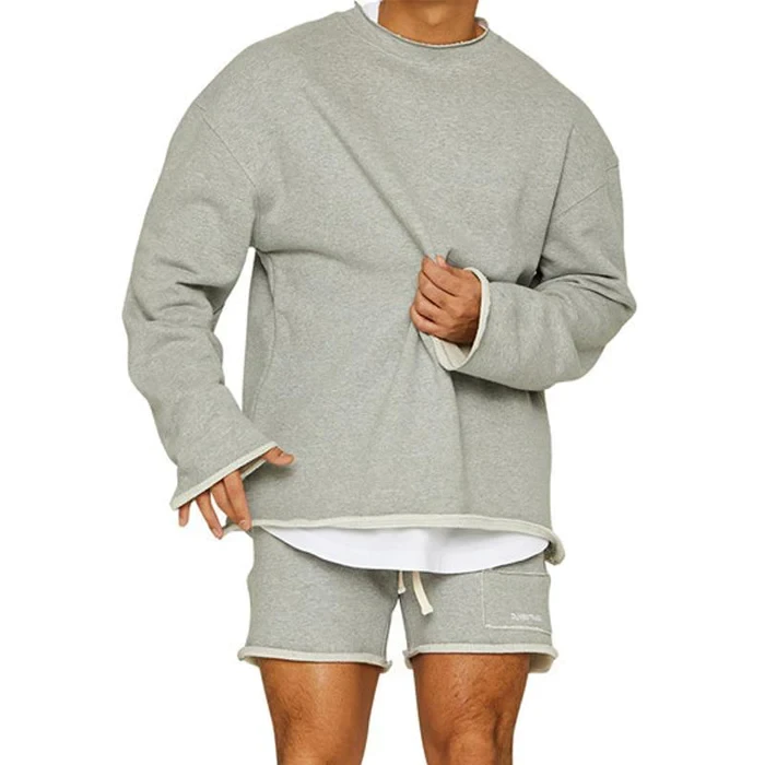 Conjunto de sudadera y pantalones cortos sueltos de color liso a la moda para hombre
