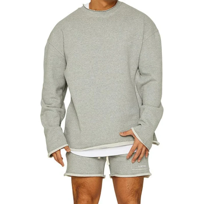 Conjunto de sudadera y pantalones cortos sueltos de color liso a la moda para hombre