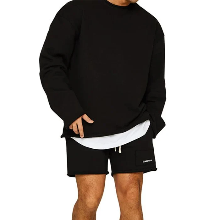 Conjunto de sudadera y pantalones cortos sueltos de color liso a la moda para hombre