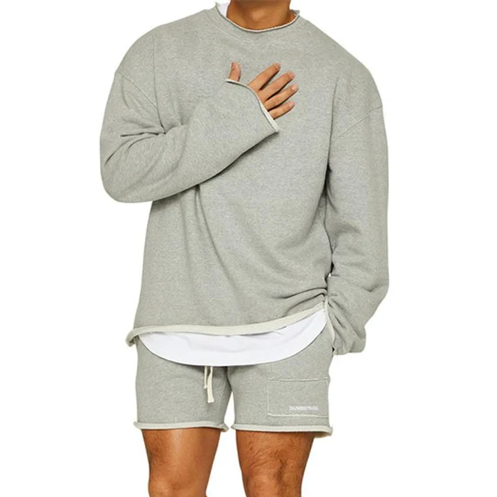 Conjunto de sudadera y pantalones cortos sueltos de color liso a la moda para hombre