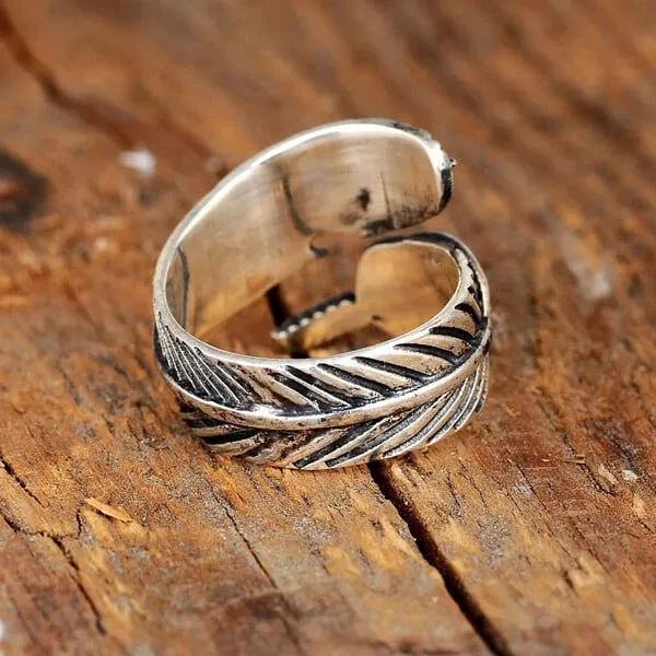 Anillo ajustable turquesa con plumas bohemias (preventa navideña)
