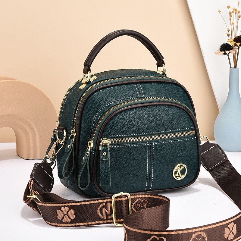 Bolso bandolera con múltiples cremalleras