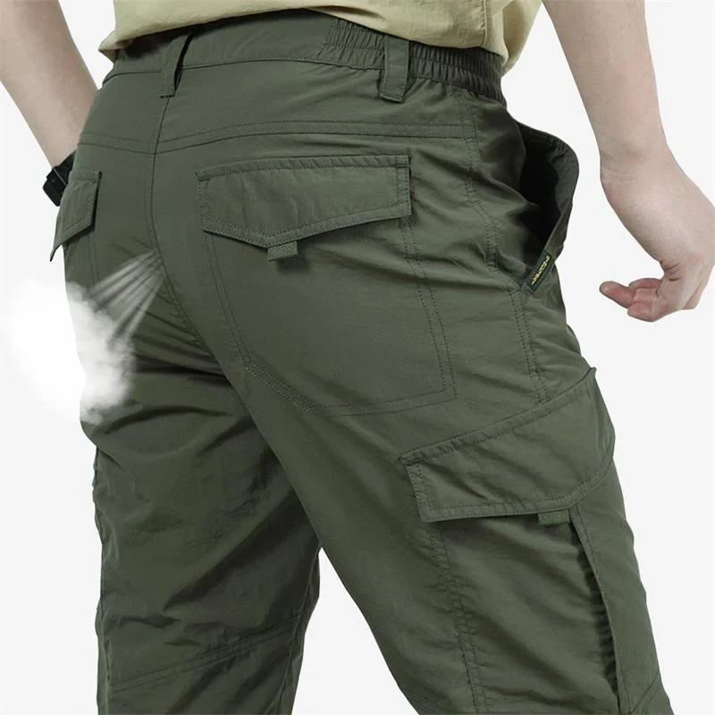 Pantalones cargo holgados con cintura elástica y múltiples bolsillos para hombre