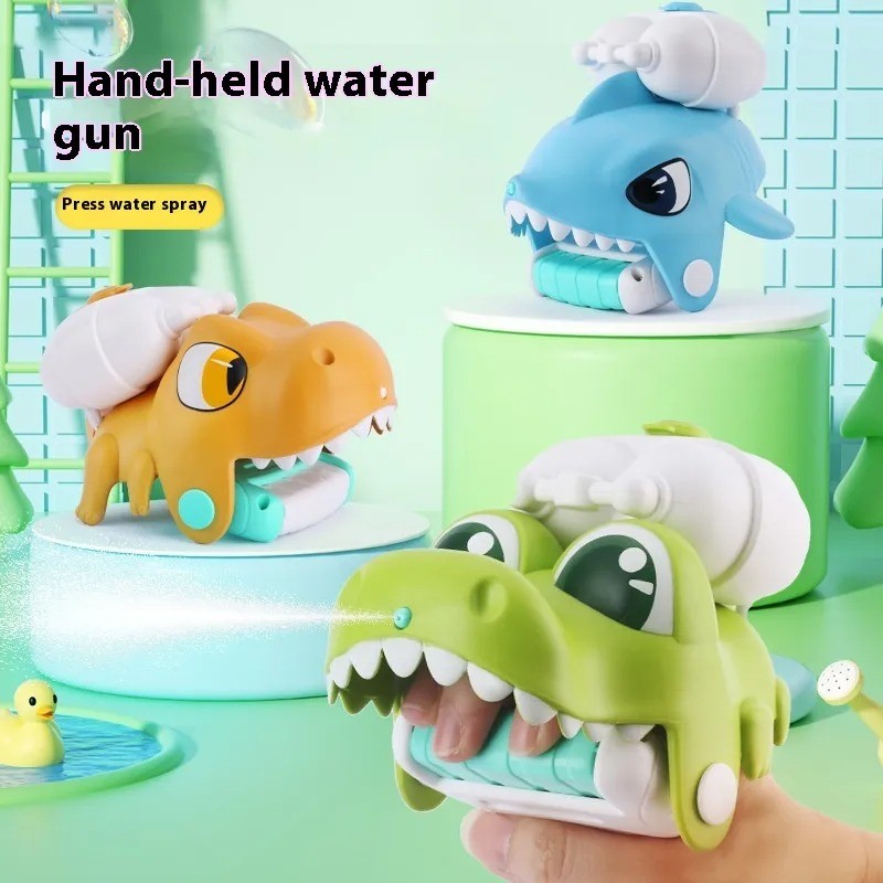 Pistola de agua de mano de goma suave para niños, juguete para jugar en la playa o en el baño.