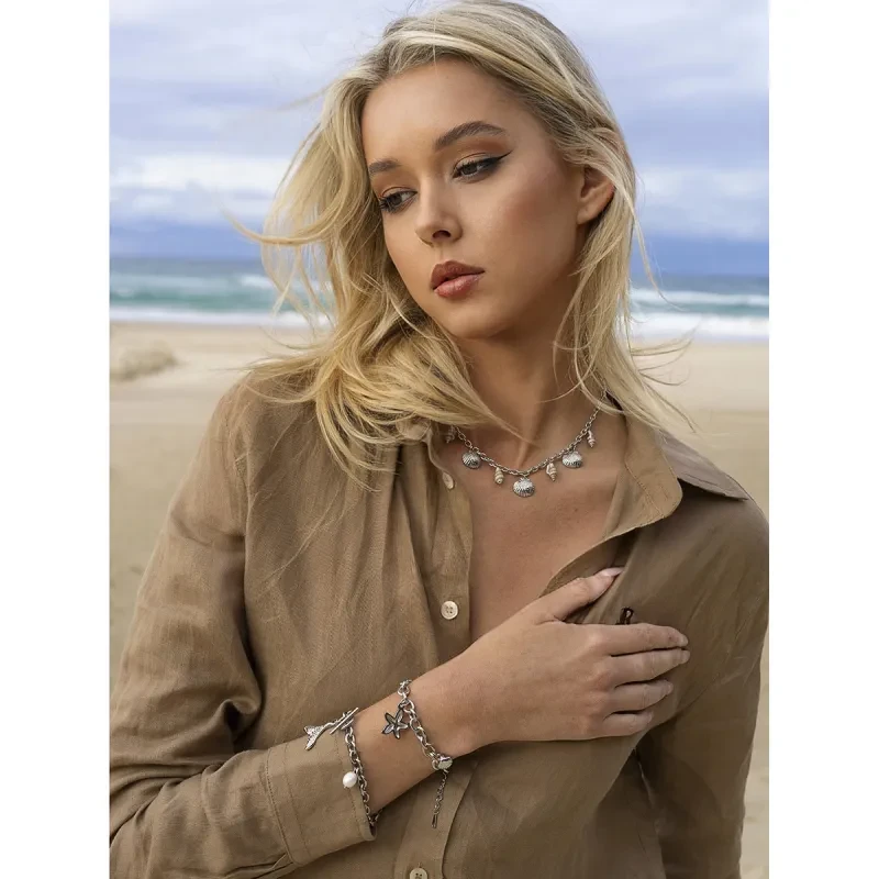 Pulsera de acero inoxidable con forma de estrella de mar y caracola