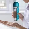 Botella de agua con pastillero semanal