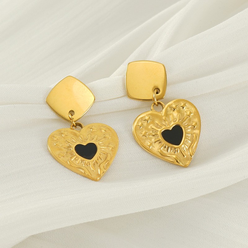Pendientes de corazón con aceite goteando