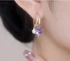 Pendientes de perlas con flores de cuatro hojas y cristales de moda