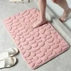 Alfombra de baño con relieve de adoquines