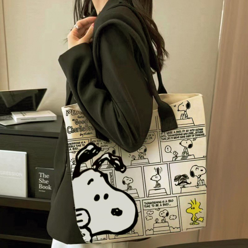 MINISO - Bolso de lona con estampado de Snoopy, gran capacidad, informal, versátil, para compras y para el hombro