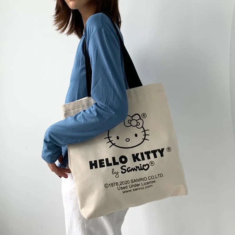 MINISO Disney - Bolso de lona para mujer, diseño de Hello Kitty, ideal para ir de compras, de viaje y de diseño de lujo
