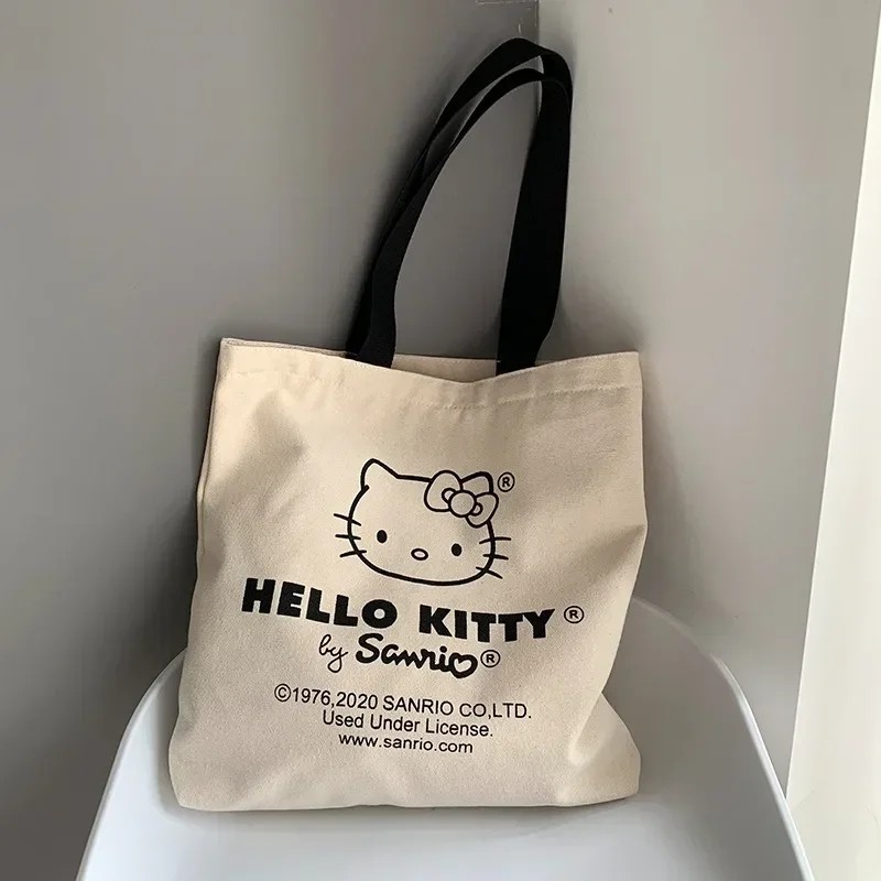 MINISO Disney - Bolso de lona para mujer, diseño de Hello Kitty, ideal para ir de compras, de viaje y de diseño de lujo