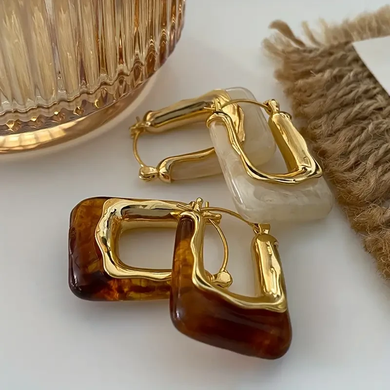 1 par de elegantes pendientes de aro en forma de U