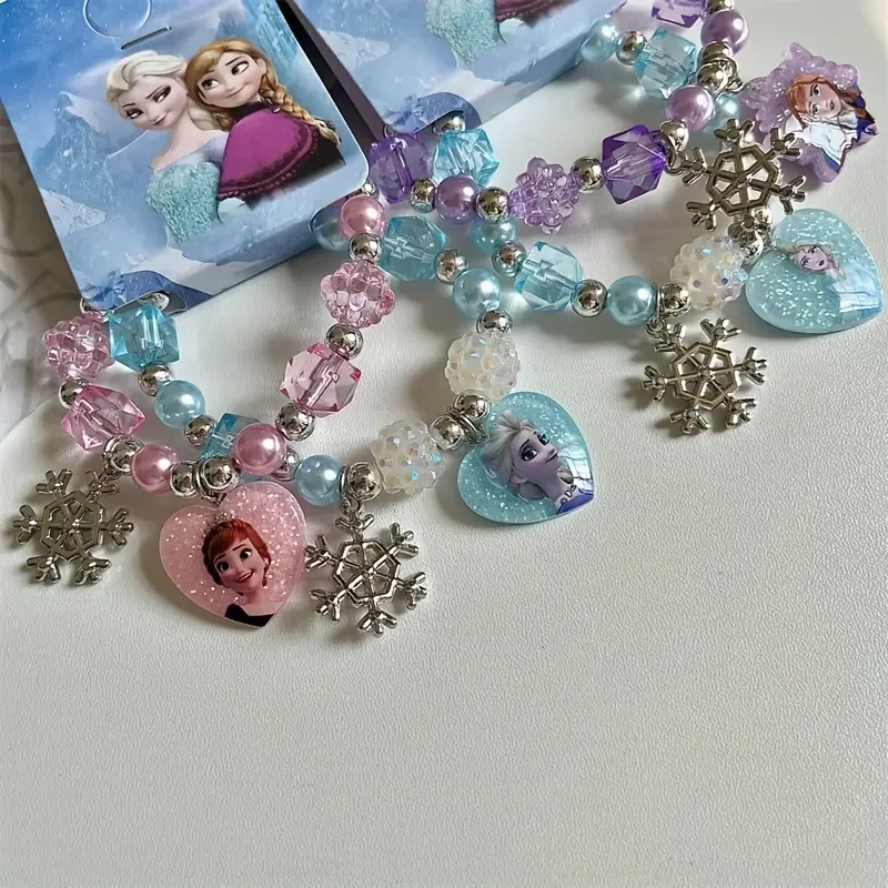 Pulsera con dijes de la Princesa Anna y la Reina Elsa de Frozen