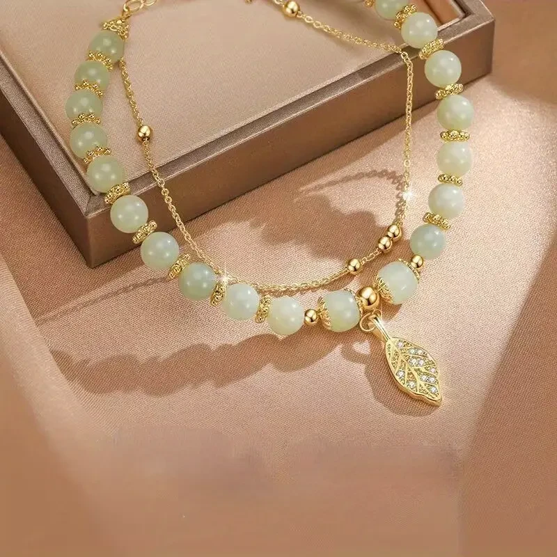 Exquisita pulsera con colgante de cuentas de vidrio en forma de hoja