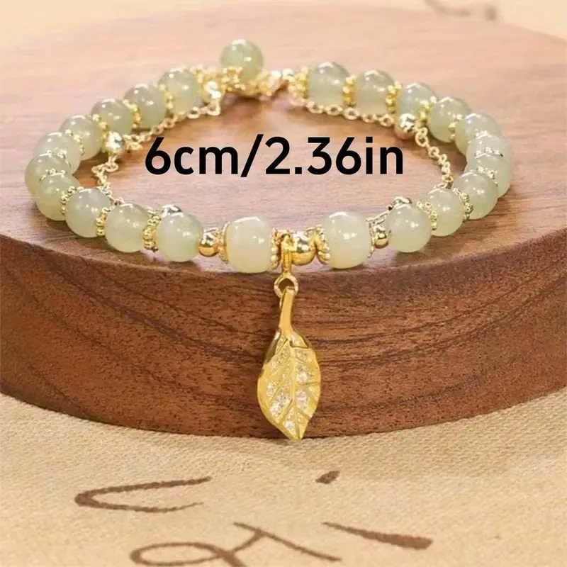 Exquisita pulsera con colgante de cuentas de vidrio en forma de hoja