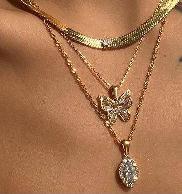 Collar de acero y titanio con circonitas de ojo de caballo en forma de aceituna y perforación completa