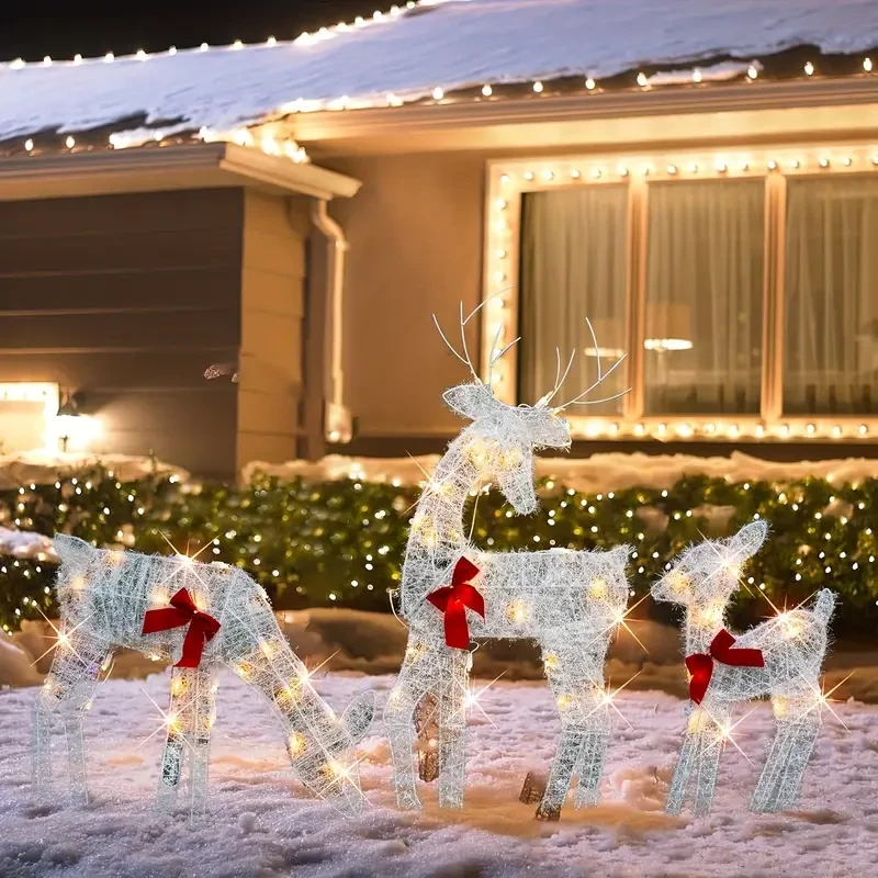Encantadora decoración iluminada de familia de renos de cristal blanco. Funciona con pilas, luces intermitentes para Navidad y Halloween en exteriores.