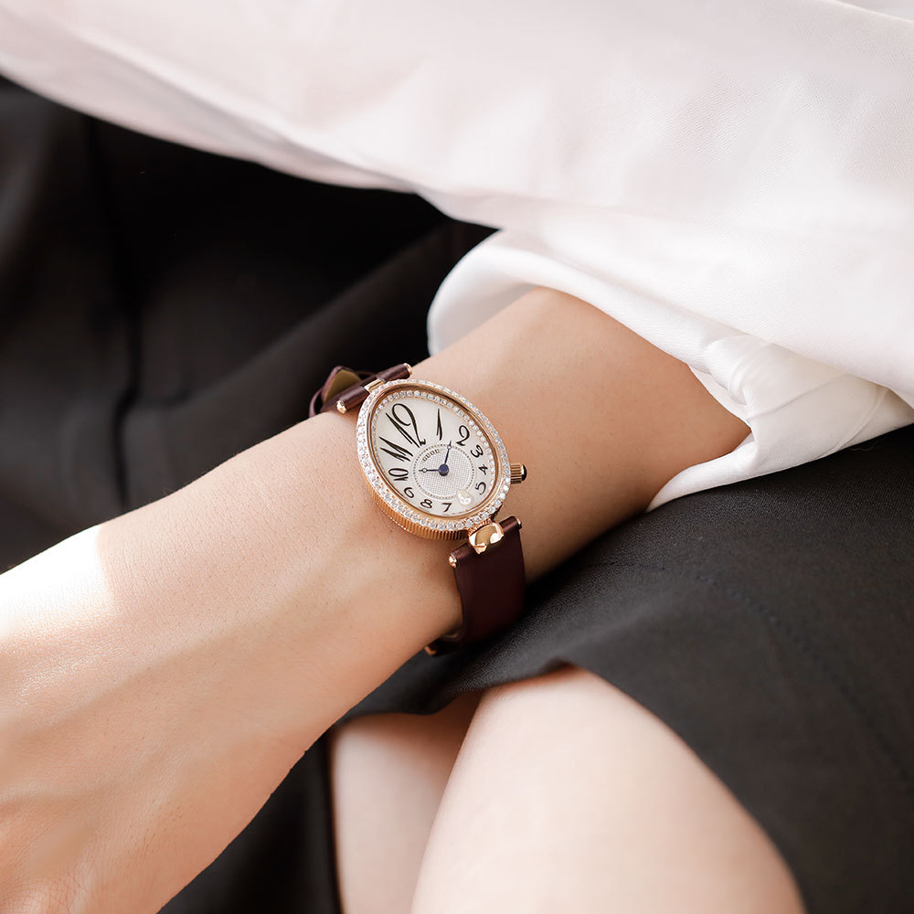 Reloj ovalado de estilo generoso, elegante y retro con forma de gota para mujer