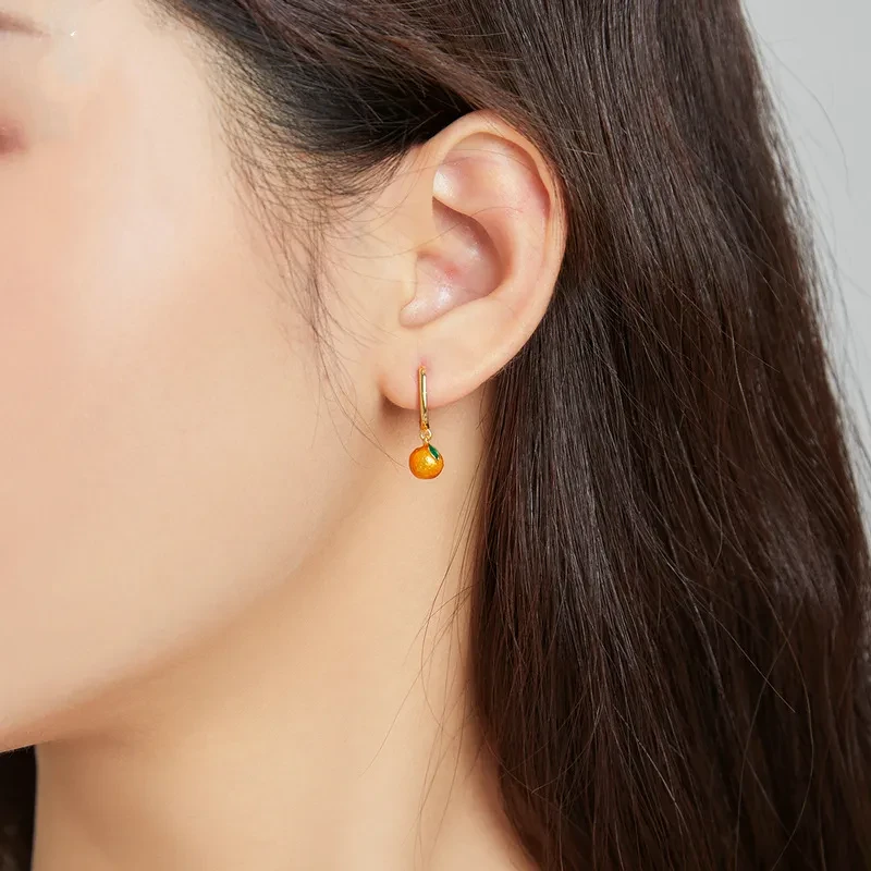 Pendientes de botón individuales de plata de ley con gota de aceite naranja