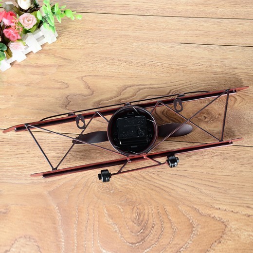 Reloj de pared vintage de hierro forjado con diseño de avión