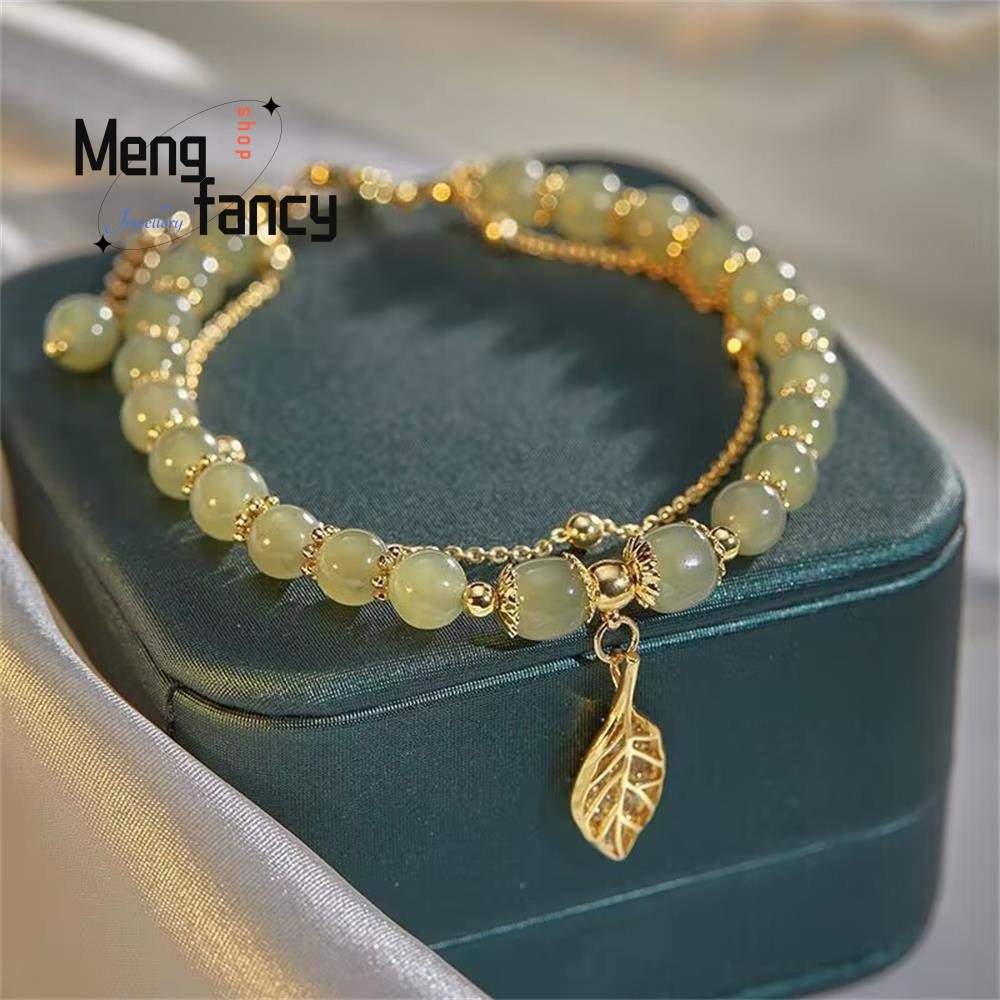 Pulsera de jaspe hetiano natural con dije de rama dorada y hojas de jade