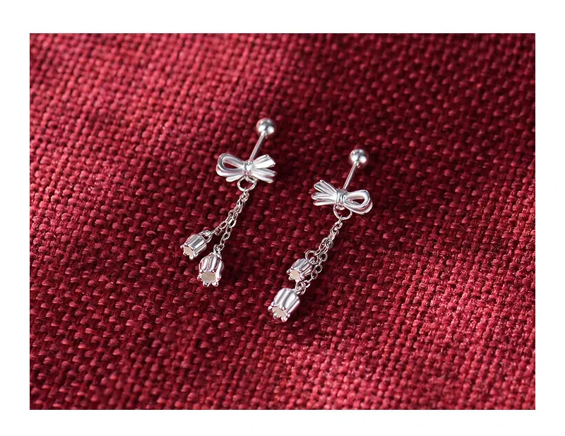 Pendientes dulces con borlas y hueso