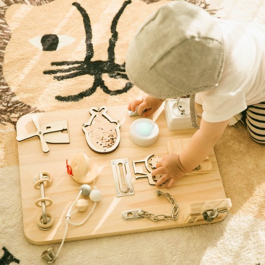 Meta Description: The Children's Busy Board is an educational Montessori toy that promotes early learning, fine motor skills, and problem-solving. Perfect for toddlers and preschoolers, this interactive teaching aid is available for wholesale customizatio