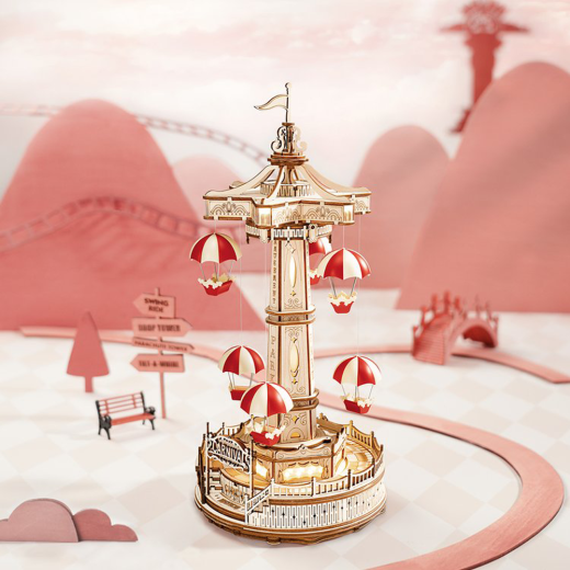 Create a magical amusement park with the Robotime ROKR Parachute Tower DIY music box. This 3D wooden puzzle features a moving parachute tower and plays a beautiful melody. Perfect as a birthday gift or Christmas present for kids and puzzle enthusiasts.
