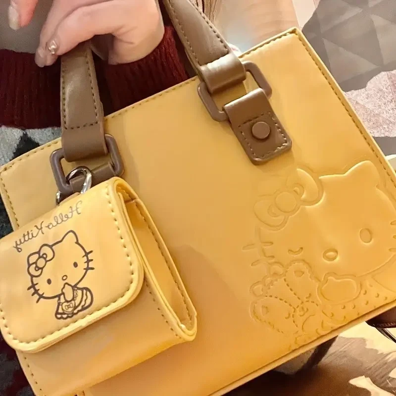 Elegante bolso de mano con asa superior, ligero, de piel sintética, resistente al agua y a las manchas, con diseño de dibujos animados en relieve y monedero a juego, ideal para uso diario y oficina. Un elegante accesorio de moda.