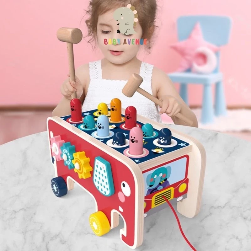 Xilófono de madera con forma de elefante que golpea a un hámster. Juguete educativo para niños.