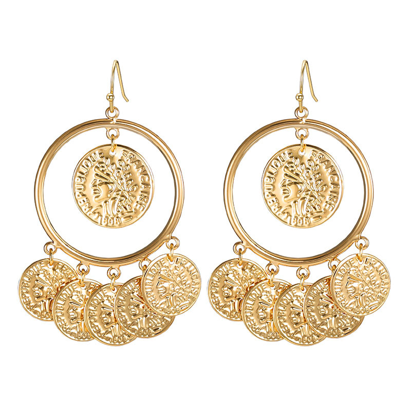 Pendientes vintage de metal y cobre.