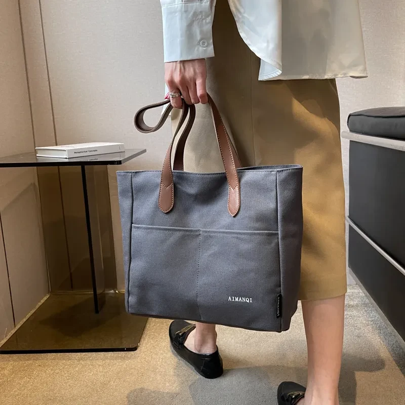 Bolso de mano de lona de gran capacidad con textura nicho para el hombro