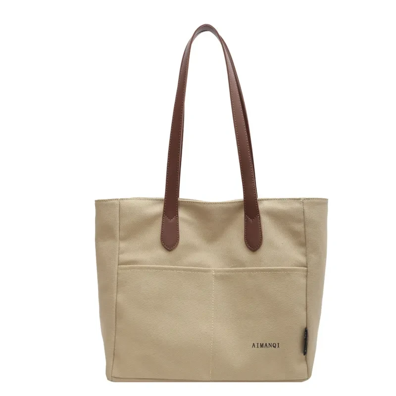 Bolso de mano de lona de gran capacidad con textura nicho para el hombro