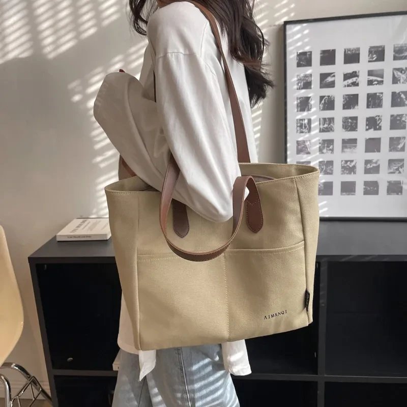 Bolso de mano de lona de gran capacidad con textura nicho para el hombro