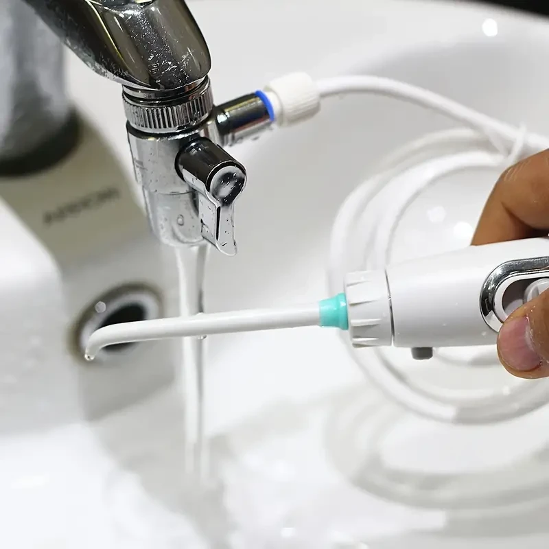 Irrigador bucal eléctrico con adaptador de grifo