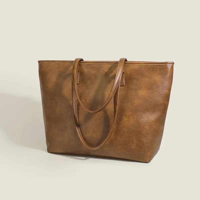 Nuevo bolso de mano retro de gran capacidad para mujer, sencillo, para el día a día, con bandolera de color liso.