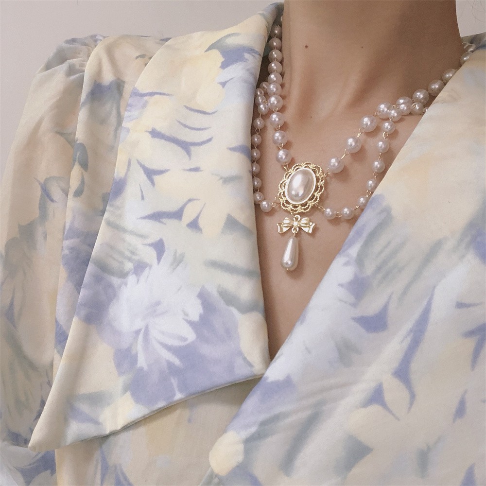 Elegante collar de corazón de perla blanca