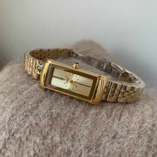 Reloj de cuarzo con correa de acero retro, rectangular y dorado para mujer.