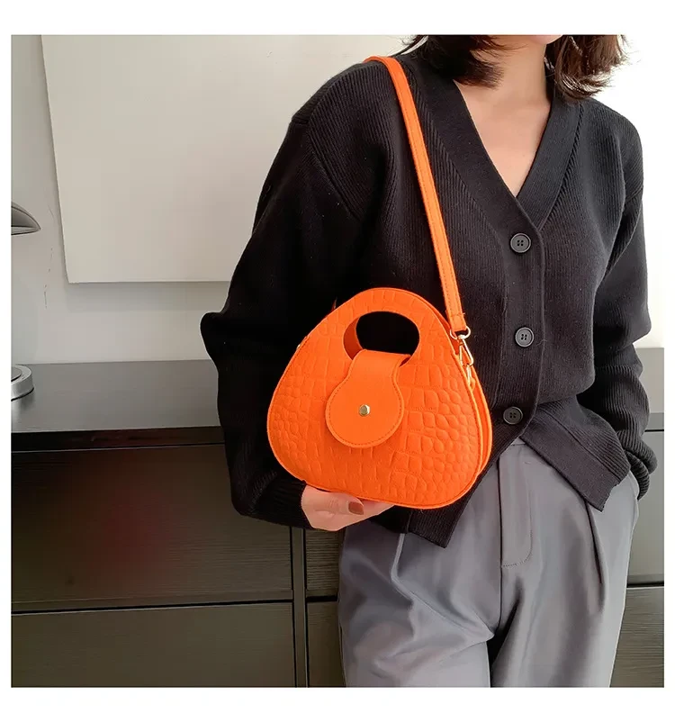 Bolso bandolera pequeño y redondo para el día a día, sencillo y portátil.