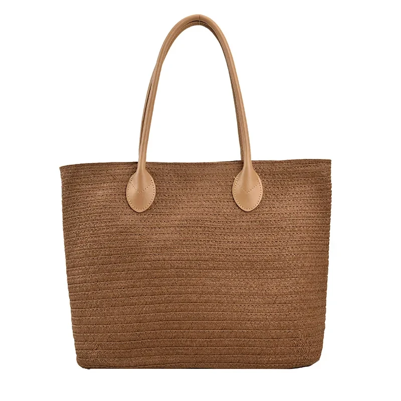 Bolso de playa tejido estilo vacaciones junto al mar