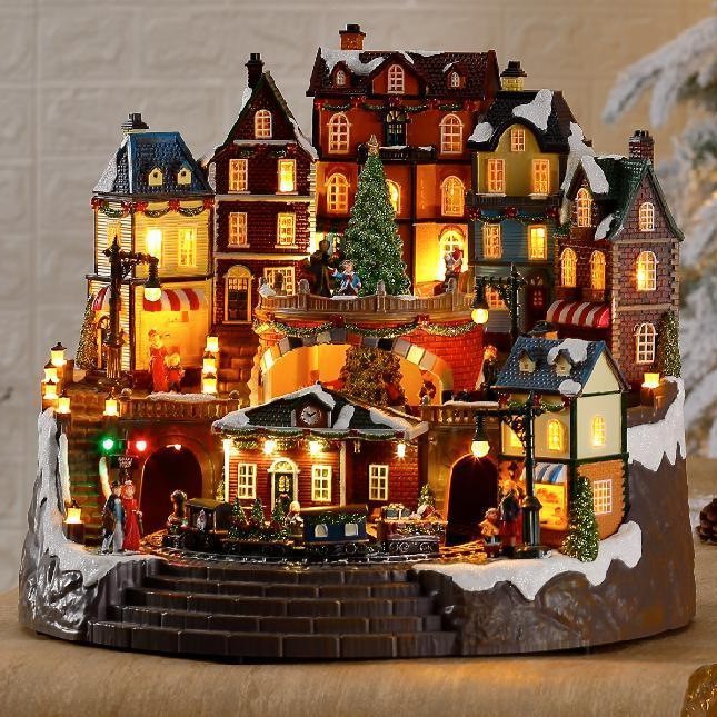 Gran casa musical LED luminosa con tren giratorio y adornos navideños giratorios.